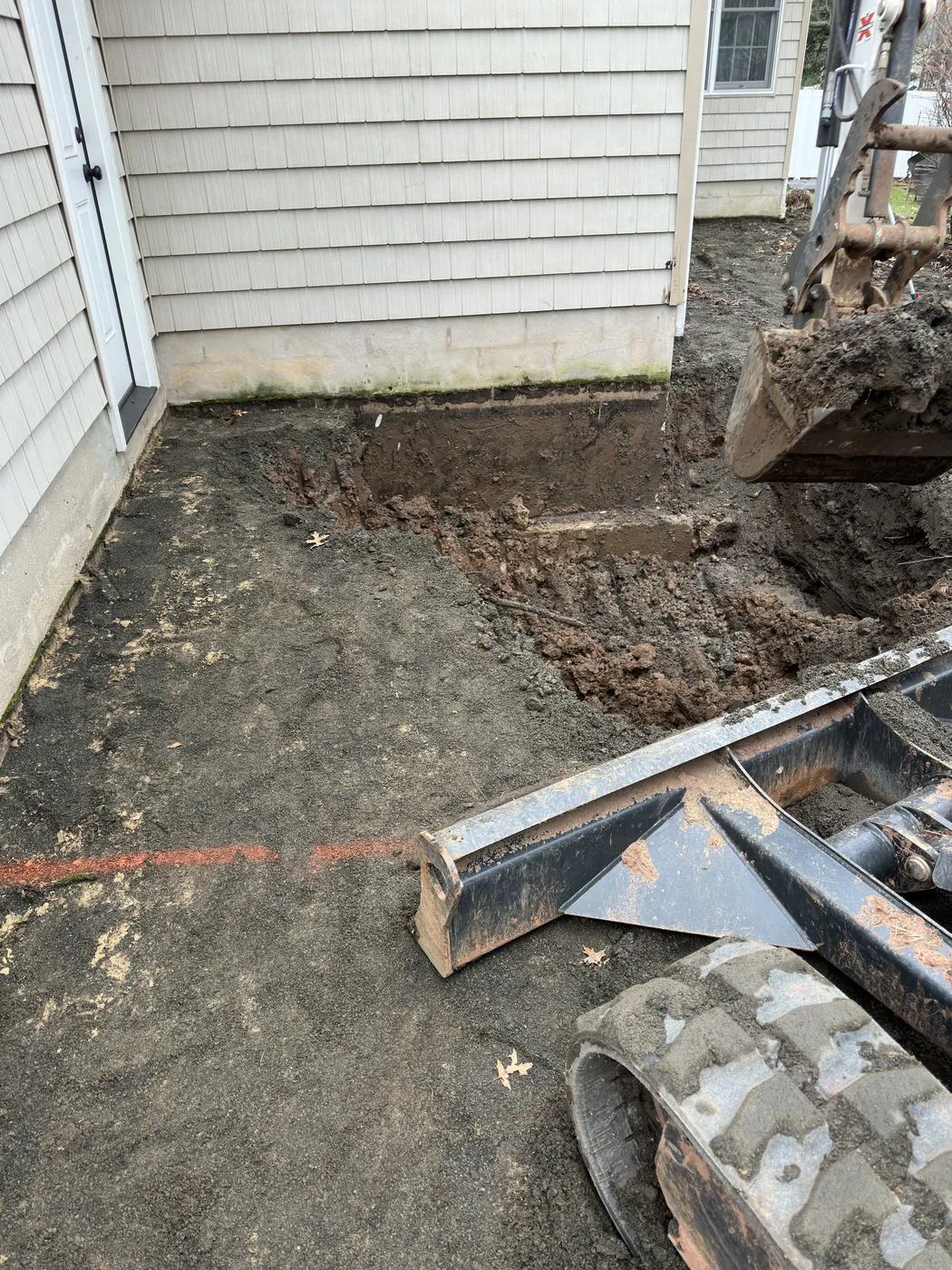 Foundation excavation to framed addition — before